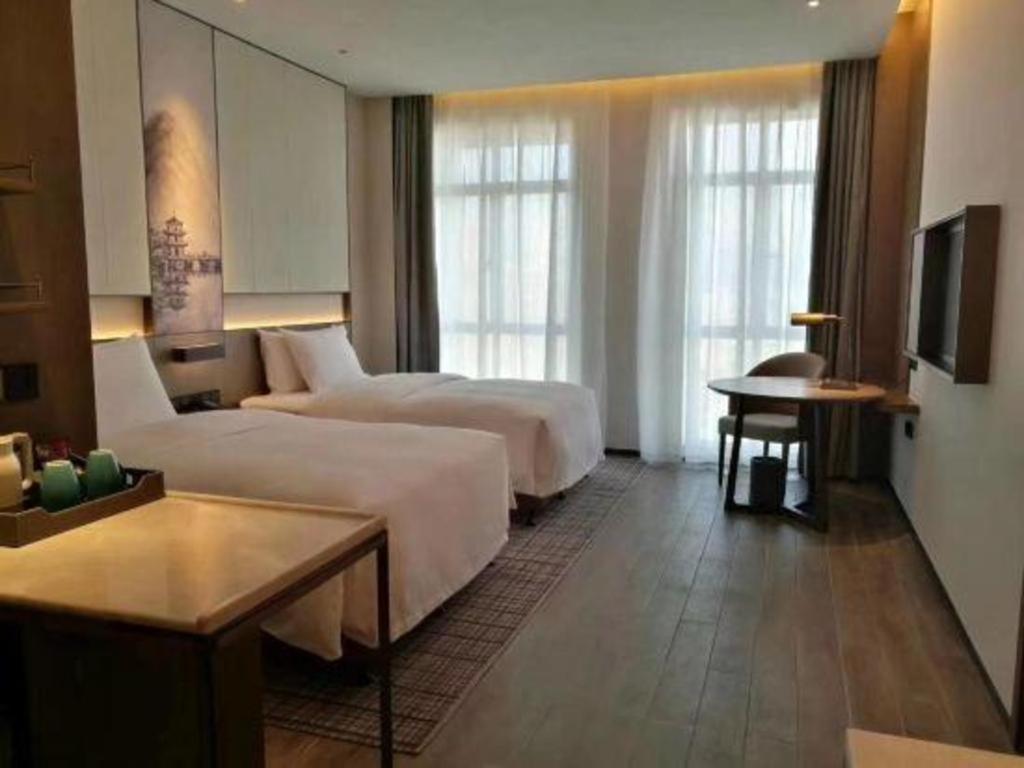 Wanda Jin Baise Hotel Екстериор снимка